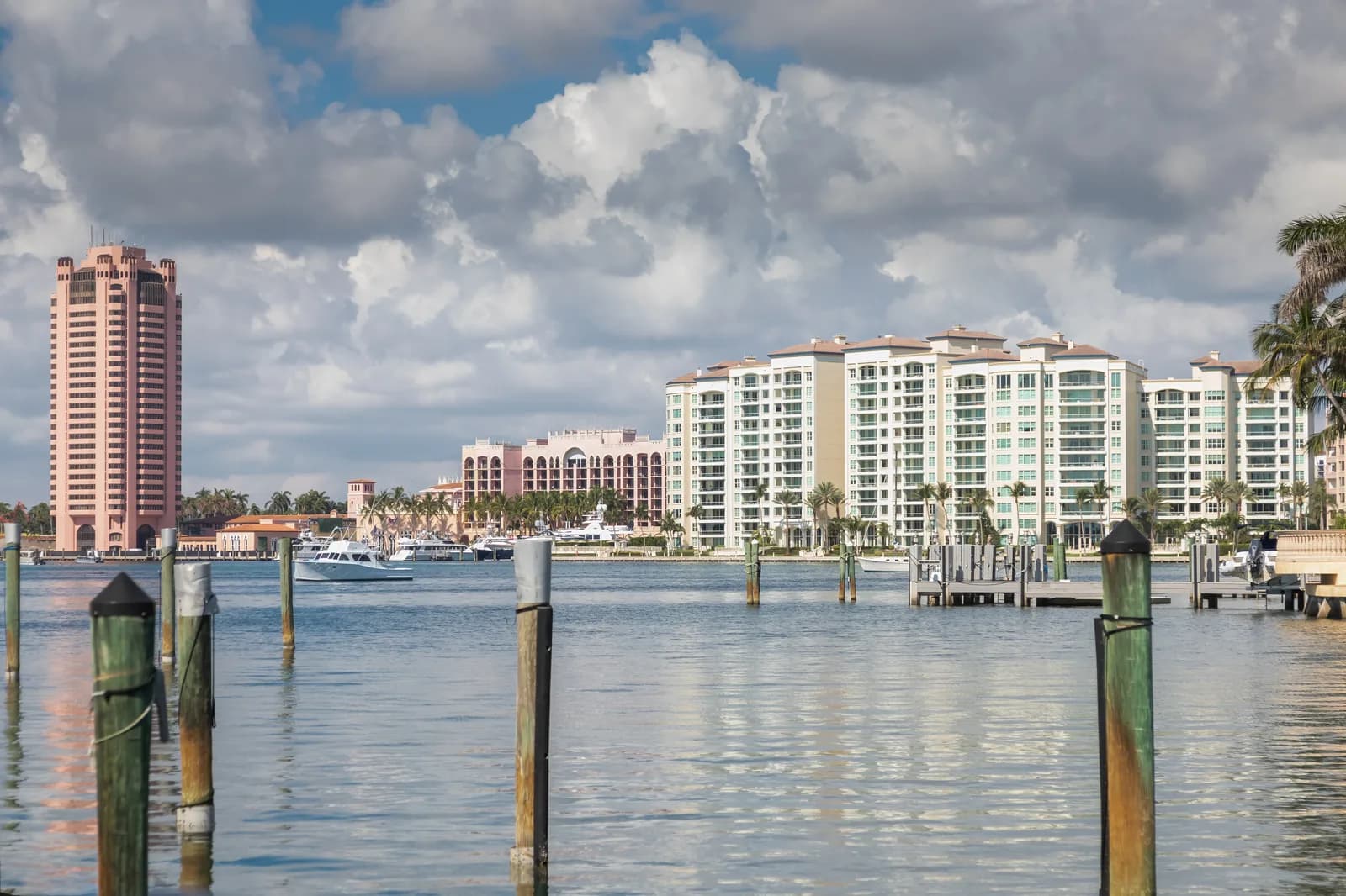 Waterfront buildings and moored boats across Lake Boca Raton